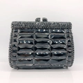 Macro shot of luxury black faceted crystal rows on hard shell rhinestone clutch bag - Black