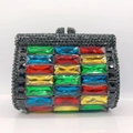 Detailed close-up of a rhinestone evening clutch featuring vibrant multi-colored gemstones - Black Base with Colorful Crystals