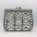 Macro shot of silver frame and rectangle crystals on luxury rhinestone clutch purse - Silver
