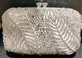 Elegant white satin clutch purse with sparkling crystal leaf pattern and rhinestone closure - White