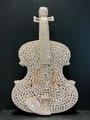 Detail shot of violin-shaped evening clutch bag encrusted with white rhinestones - Gold White