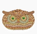 Detailed close-up of owl evening clutch bag with golden rhinestones and green jewel eyes - Gold Multicolor