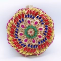 Detailed close-up of a round evening clutch with vibrant multicolored spiral rhinestones - Round Golden Multicolor