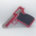 Macro shot of handgun shaped evening clutch with sparkling red and black rhinestones - Black Red Silver