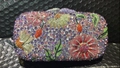 Close-up of luxury clutch with colorful floral rhinestone patterns and intricate crystal details - Multicolor Violet