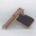 Detailed view of the sparkling rhinestone pistol-shaped clutch bag with gold and black crystals - Black Gold Silver Mixed