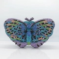 Detailed macro of crystal butterfly clutch with colorful rhinestones and metal butterfly clasp - Violet Multicolor