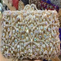 Macro detail of luxury evening clutch with AB crystals and golden hollow metal frame - Gold with AB Iridescent Crystals