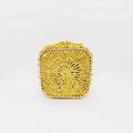 Detailed view of square gold evening bag with radiant rhinestone pattern and metal clasp - Yellow