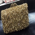 Macro view of golden starfish evening clutch with crystal inlay and hollow metal lock - Gold / Gold Rhinestone