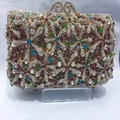 Close-up of golden hollow metal frame and colorful rhinestone starfish pattern on clutch - Gold Multicolor