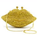 Detail of lip-shaped evening bag with sparkling rhinestones and gold chain strap - Yellow