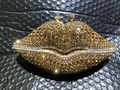 Detailed view of the gold rhinestone lips evening clutch with shimmering crystal buckle - Gold/AB Rhinestones