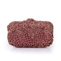 Detailed view of pink crystal rhinestones and sequins on a floral metal evening clutch bag - Pink