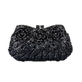 Macro detail of luxury black evening clutch featuring three 3D crystal roses and metal texture - Black