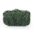Macro shot of luxury evening clutch with green rhinestones and floral spiral patterns - Green