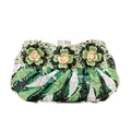 Detail of evening clutch featuring intricate floral rhinestone patterns and metal clasp - Green