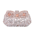 Detail of rose gold evening clutch featuring 3D metal flowers and sparkling crystals - Champagne