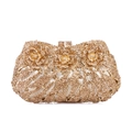 Detail of gold crystal evening clutch with 3D floral accents and diamond clasp - Gold / Gold Rhinestone