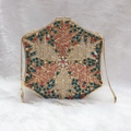 Detailed view of luxury hexagonal evening bag featuring multi-color crystals and gold chain - Gold Multicolor