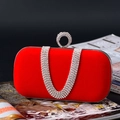 Detail of red velvet clutch bag featuring a crystal-encrusted ring handle and diamond chain - U-Shaped Rhinestone Red (A860)