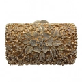 Macro detail of luxury dinner clutch featuring hollow metal and exquisite crystal floral pattern - Gold / White Zirconia