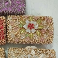 Detailed view of hollow metal evening clutch bags with sparkling floral crystal patterns - Gold Multicolor