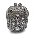 Macro shot of silver evening clutch with rhinestones and crystal bow clasp detail - Full Rhinestone Hard Shell Style / Silver