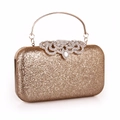 Elegante pochette da sera dorata con paillettes, chiusura a fiore di strass e manico - Oro