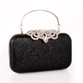 Elegante pochette da sera con paillettes nere, manico dorato e chiusura con strass - Nero