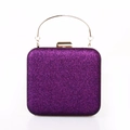Close-up of sparkling purple sequin evening clutch bag with round gold metal handle - Purple