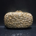 Detailed view of champagne gold evening clutch bag with radiating crystal rhinestone pattern - Gold Base with Yellow Crystal