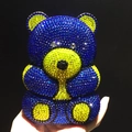 Close-up of bear-shaped evening bag with blue and yellow sparkling rhinestones - Royal Blue Bear