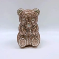 Close-up of a teddy bear evening clutch featuring pink and silver rhinestones detail - Champagne Standing Bear