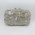 Close-up of luxury silver evening clutch with sparkling floral crystal and rhinestone pattern - Silver