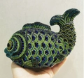 Fish-shaped evening clutch bag adorned with blue and green crystals being held - Dark Green Gradient