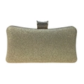 Close-up of golden glitter clutch bag featuring a sparkling crystal encrusted metal clasp - Gold