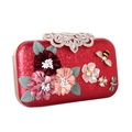 Detail of red sequined clutch with 3D fabric flowers, jewel bee and pearl accents - Red