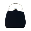 Detailed view of black velvet evening bag with gold handle and blue-gray gemstone - Black