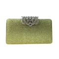 Macro detail of luxury gold glitter evening clutch bag with sparkling rhinestone closure - Gold