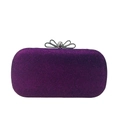 Macro detail of purple glitter evening clutch with rhinestone bow metal clasp - Purple