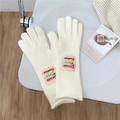 Detail of white knit gloves with rainbow brand label and soft ribbed cuff texture - One Size / Milky White