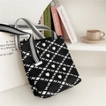 Detail of knit tote bag with black and white floral diamond pattern on shelf - Black Hourglass Grid Flower (1) / 22cmx25cmx12cm