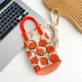Detail view of knitted heart pattern bag with red top handle and magnetic snap closure - Emoji Expression (9 Metal Buckle)