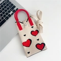 Detail of beige knitted mini crossbody bag featuring red and black heart patterns - Beige Heart (11 Metal Buckle)