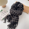 Detail of grey and beige plaid knitted scarf featuring long tassels and a leather brand label - 50*205cm (With Tassels) / Black and Beige Plaid