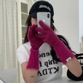 Detail of rose red knit gloves featuring plush faux fur cuffs and small label tag - One Size / Rose Purple