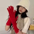 Detail of red knit gloves with finger openings for touchscreen use in winter - One Size / Red
