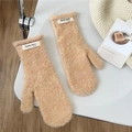 Detailed view of plush solid color mittens with fleece texture and brand label detail - Oatmeal