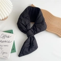 Detail of black heart-quilted down scarf with convenient cross-insert design and warm lining - Black